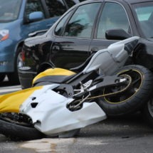 Motorcycle crashes into car