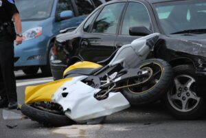 Motorcycle crashes into car