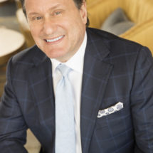 Photo of Attorney Jeff Rasansky sitting down
